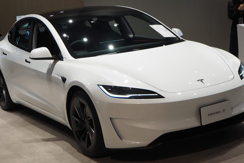 A white 2024 Tesla Model 3 Performance on display